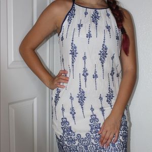 White dress with blue embroidering